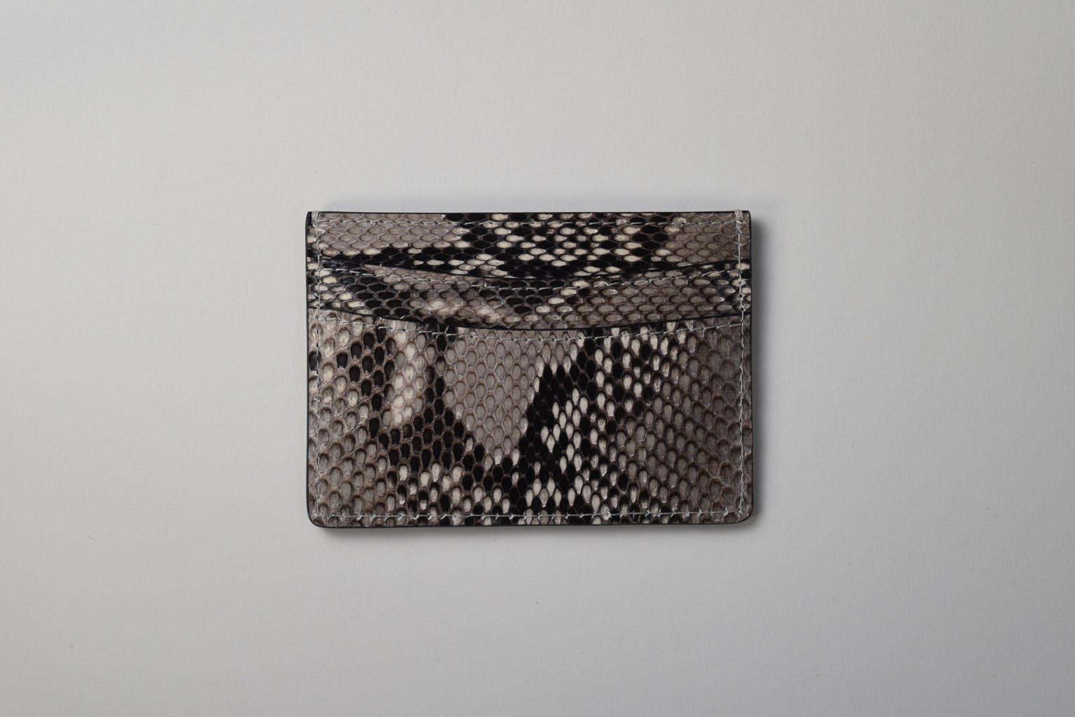 the python skin card holder on a white background